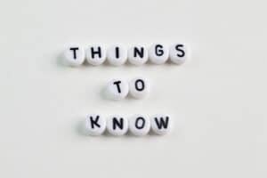 The words "Things to Know" on white beads in black on a white background. A reputable septic system company wants you to know these 6 things before installation of your septic system. Red Dirt Septic can help!